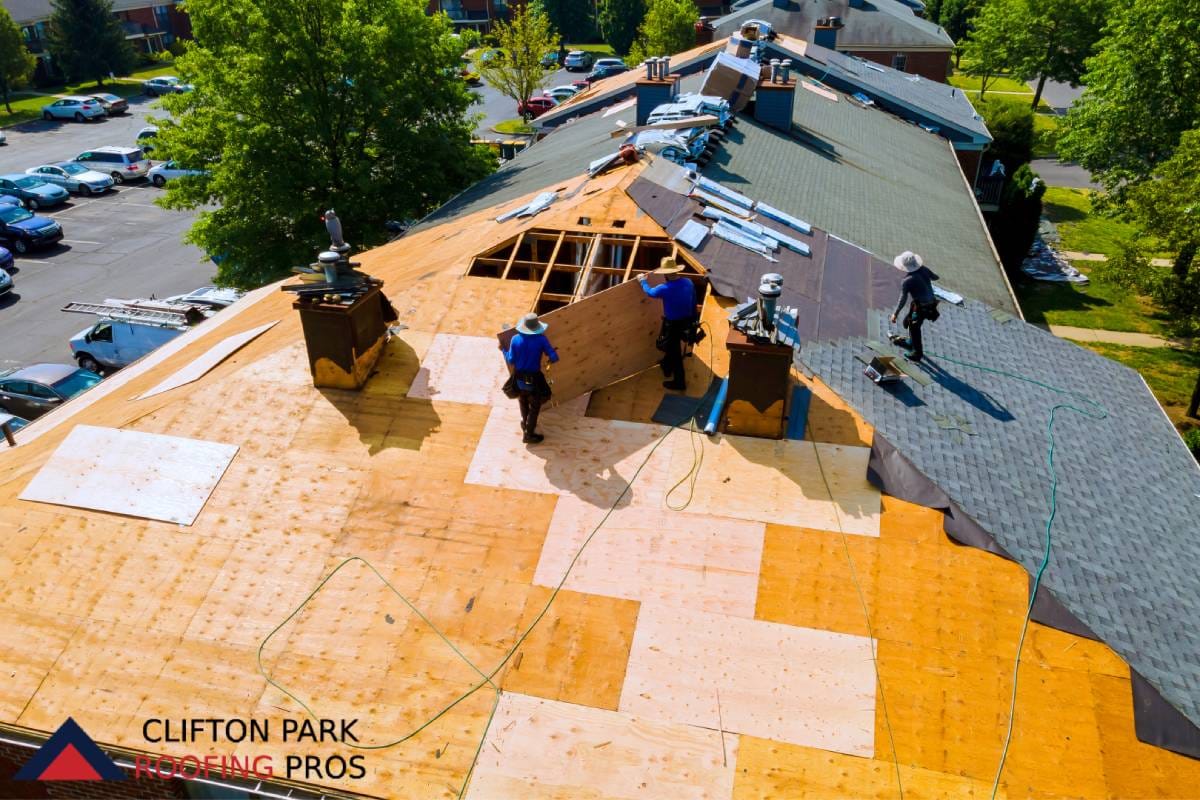Aerial view of full roof tear-off replacement in progress